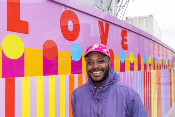 'As You pass Me By, Know That There Is Nothing But Love From Me' artwork by Yinka Ilori MBE, installed on Ashley Road East site hoarding at Tottenham Hale