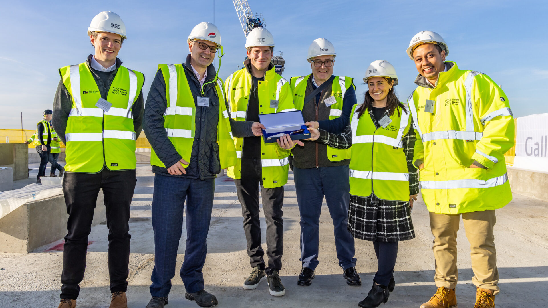 Pictured l-r, Jamie Smith, Related Argent, Matthew Pool, MD Galliford Try, Oli Rifkind, Related Argent, John German, Invesco, Stacey Patten, Invesco and Jal Patel, ICG at the Topping Out of Plot 13, Brent Cross Town