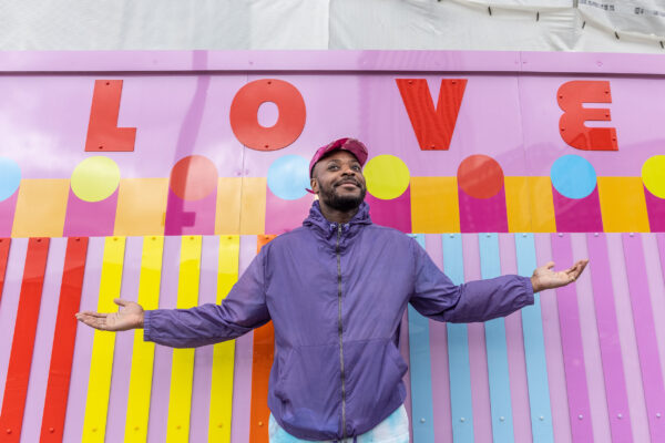 Artist in Residence Yinka Ilori with artwork at Heart of Hale